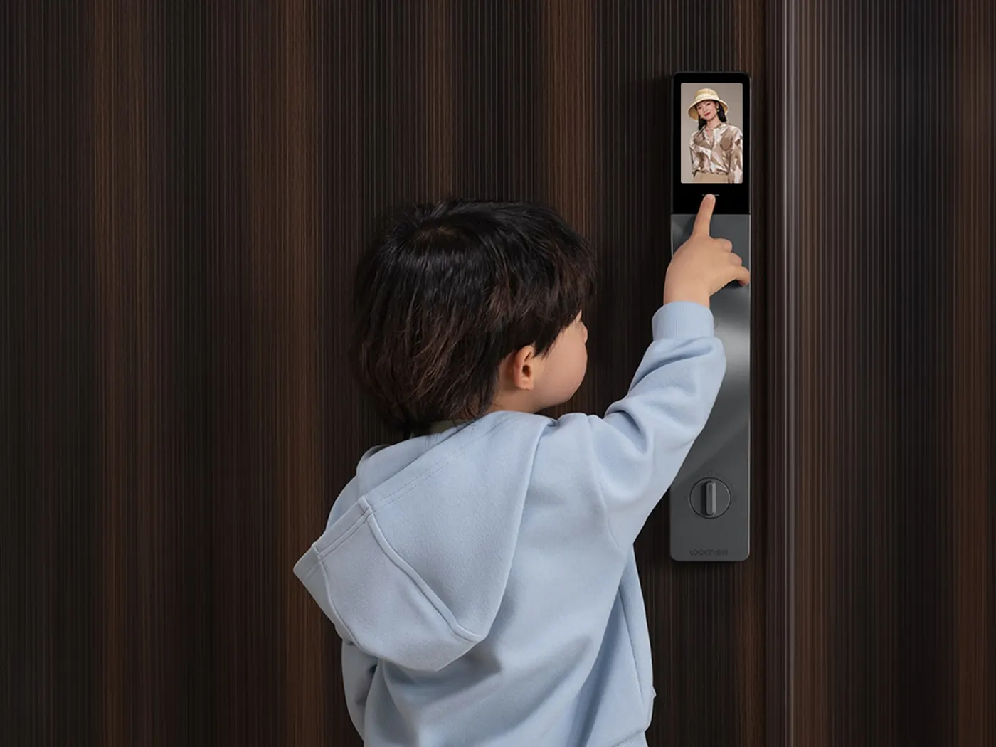 Child checking the screen on a Lockin video lock
